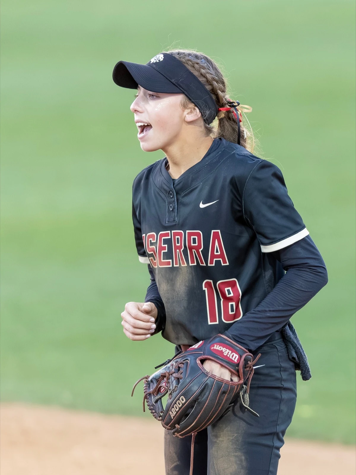 Ava Born communicating on the field in her JSerra number 18 uniform